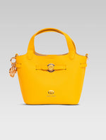 Load image into Gallery viewer, Front view of delphine bucket bag in yellow color
