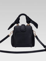 Load image into Gallery viewer, Back view of caledonia frame bag with shoulder strap in black color