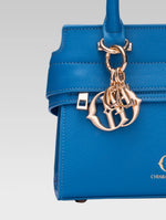 Load image into Gallery viewer, Front closeup view of ophelia envelope bag handle in baby pink color