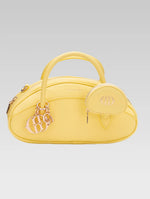 Load image into Gallery viewer, Front view of emberly envelope bag in yellow color