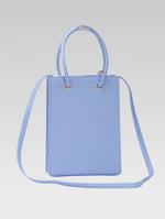 Load image into Gallery viewer, Back view of Genevieve Bucket bag in baby blue color with shoulder strap