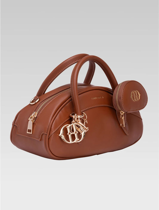 Side view of emberly envelope bag in tan color