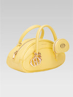 Load image into Gallery viewer, Side view of emberly envelope bag in yellow color