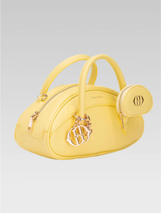 Side view of emberly envelope bag in yellow color