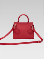 Load image into Gallery viewer, Back view of ophelia envelope bag with shoulder strap in red color