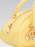 Load image into Gallery viewer, Side closeup view of emberly envelope bag handle in yellow color