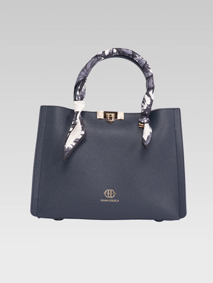 Front view of Alessia Tote bag in Bark Blue color and white clothe beaded to it's handle