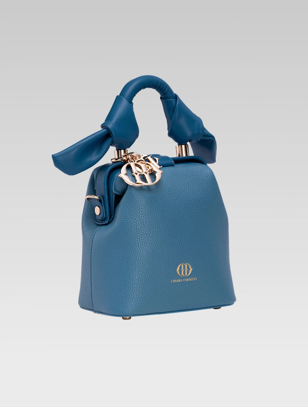 Side view of caledonia frame bag in teal color