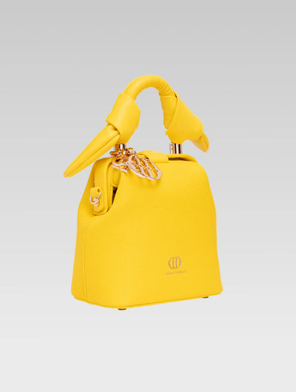 Side view of caledonia frame bag in yellow color