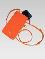 Load image into Gallery viewer, Sixtine - phone popping out of orange color phone bag with lock
