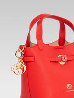 Load image into Gallery viewer, Side view of delphine bucket bag in red color
