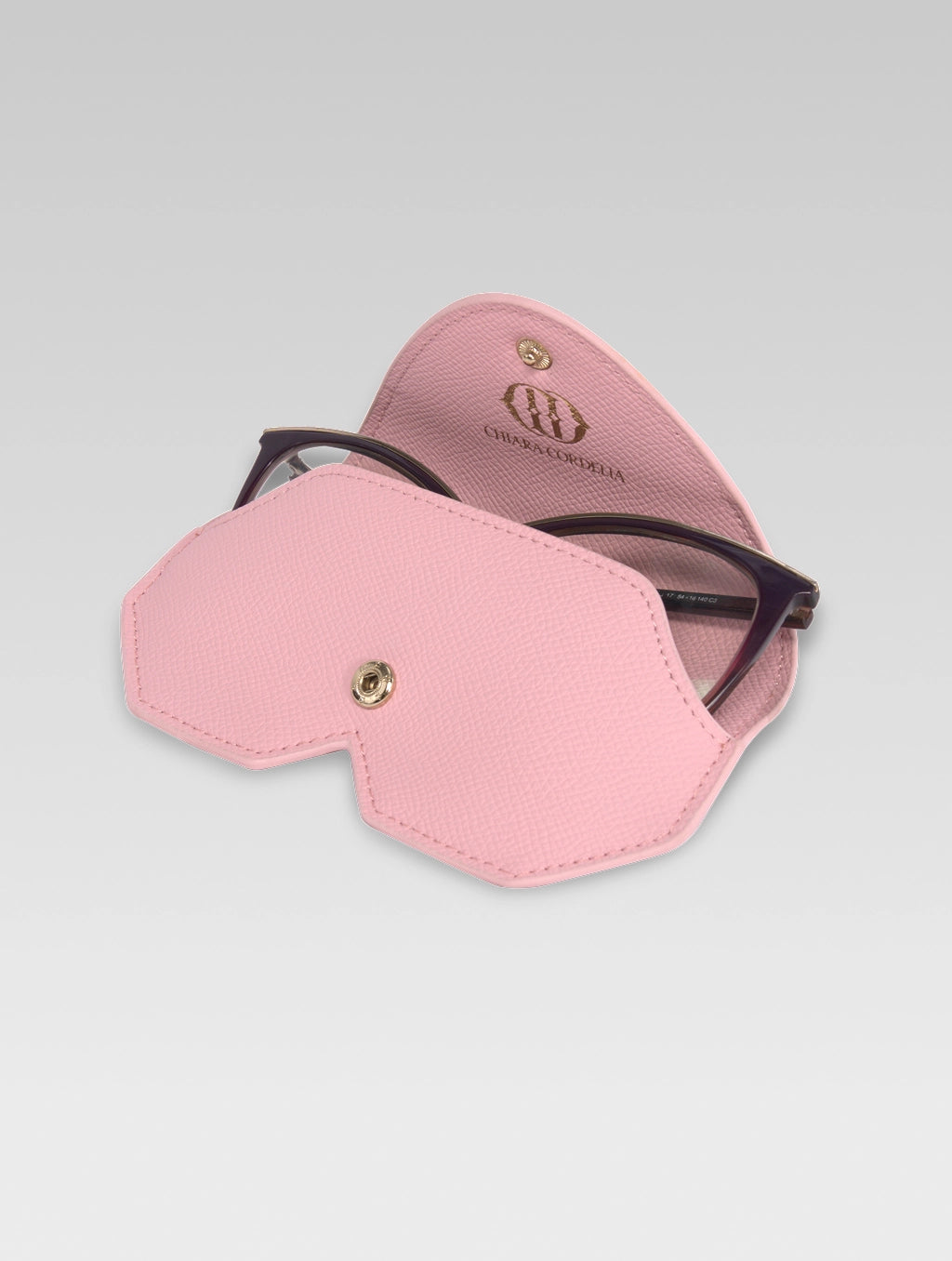 Brown specs frame popping out of Baby pink color Helena sunglass case