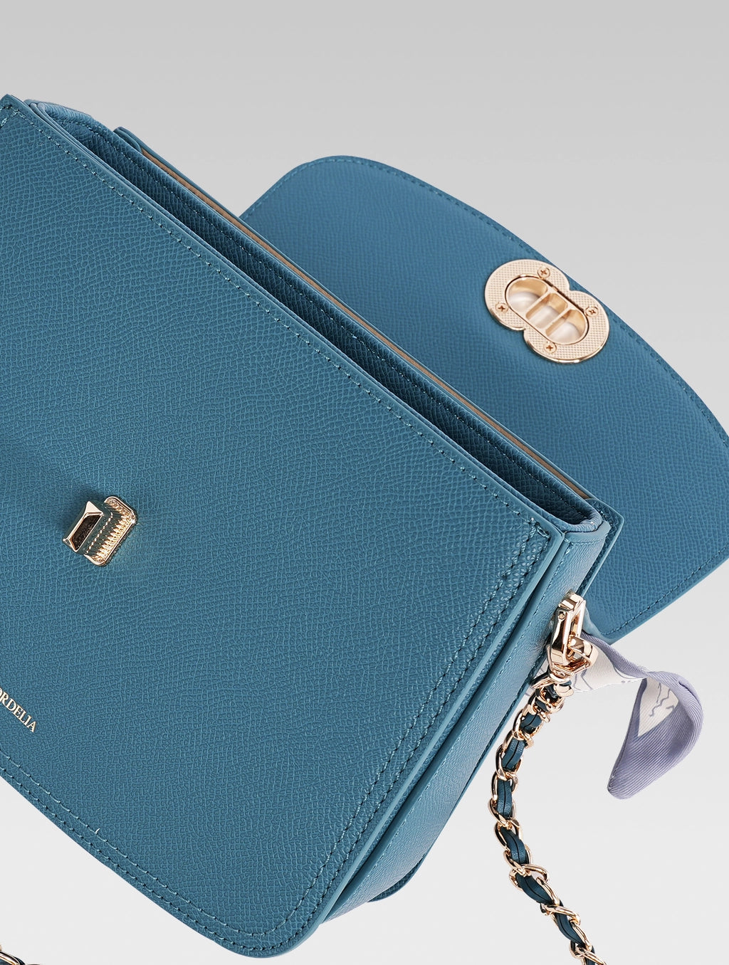 Top open view of jane envelope bag in royal teal color