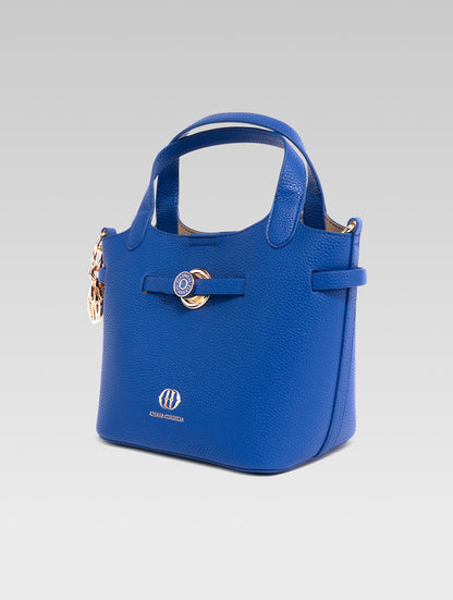 Right side view of delphine bucket bag in blue color