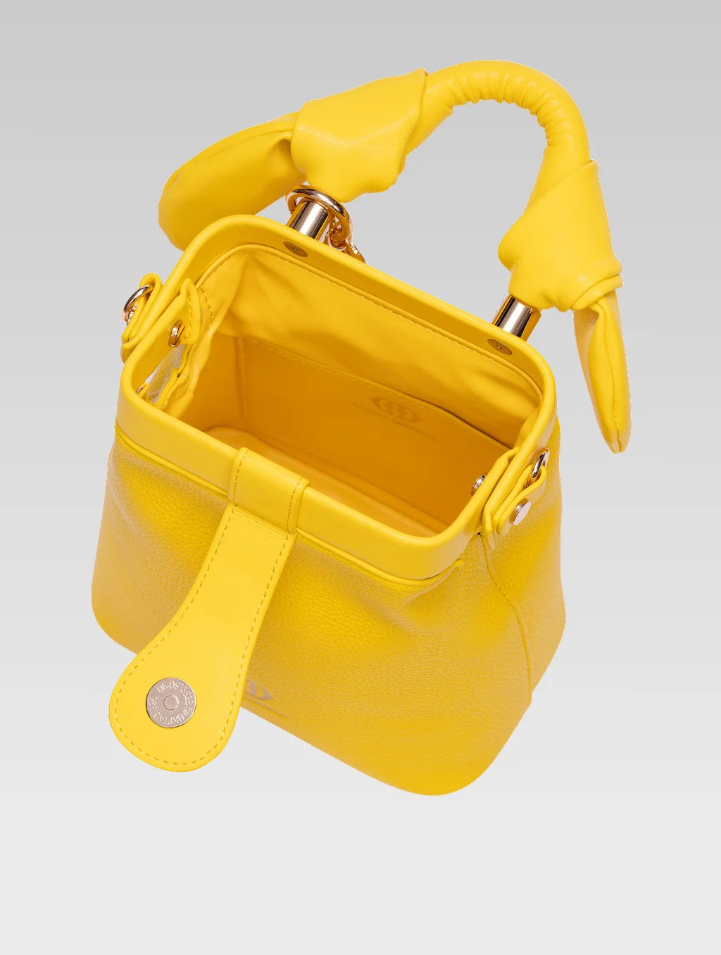 Top view of caledonia frame bag in yellow color