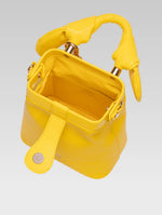 Load image into Gallery viewer, Top view of caledonia frame bag in yellow color
