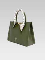 Load image into Gallery viewer, Side view of Alessia Tote bag in British Green color and white clothe beaded to it's handle
