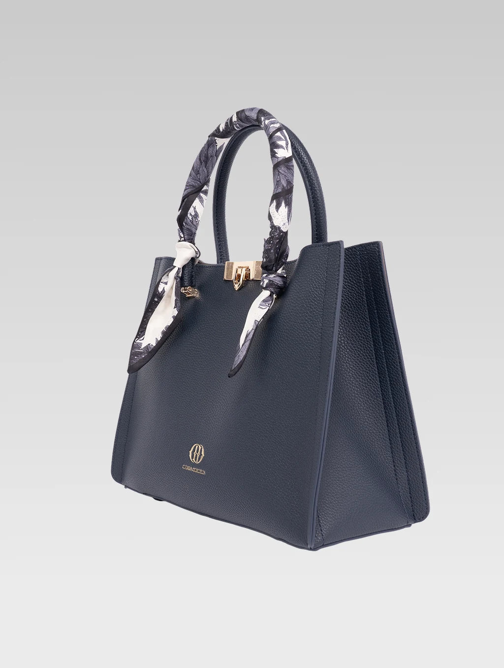 Right side view of Alessia Tote bag in Bark Blue color and white clothe beaded to it's handle