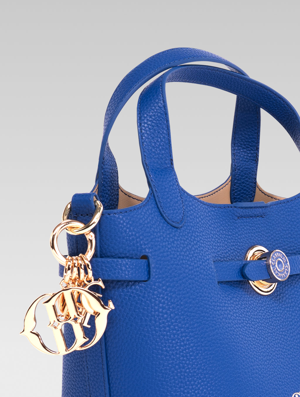 Side view of delphine bucket bag in blue color
