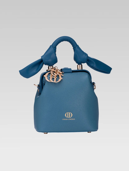 Front view of caledonia frame bag in teal color