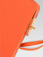 Load image into Gallery viewer, Sixtine - side lock of orange color phone bag with lock
