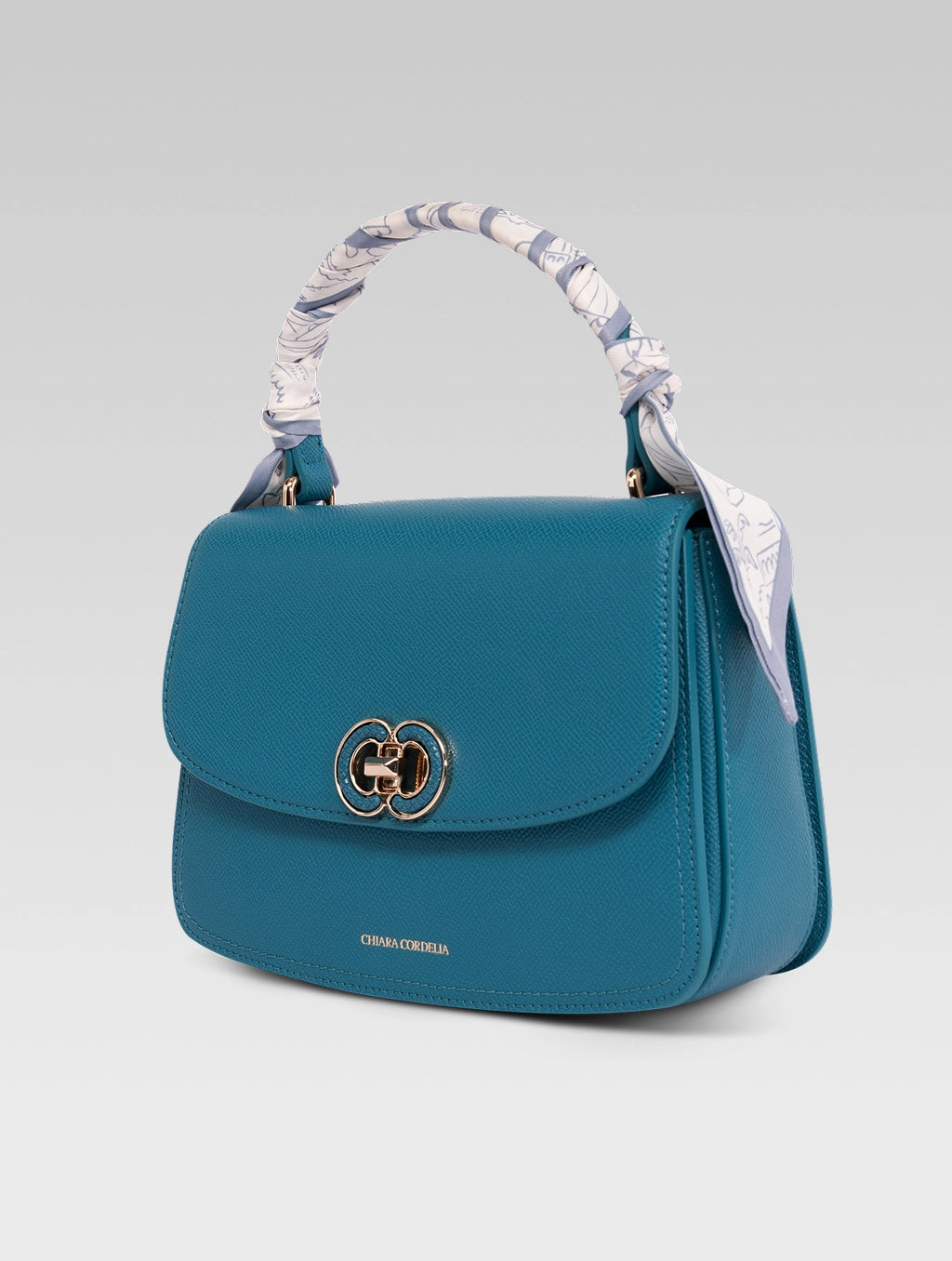 Side view of jane envelope bag in royal teal color