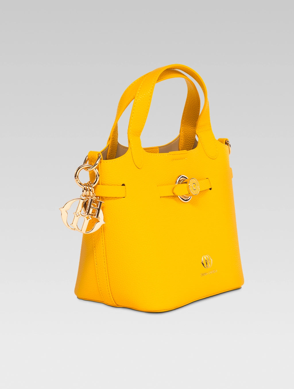 Side view of delphine bucket bag in yellow color