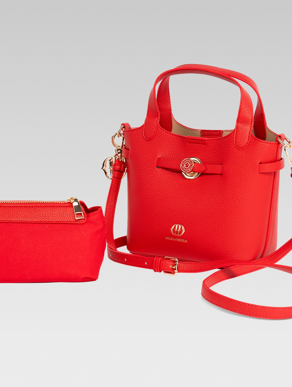 Side view of delphine bucket bag in red color with shoulder strap
