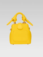 Load image into Gallery viewer, Back view of caledonia frame bag in yellow color
