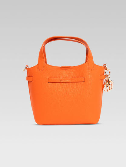 Back view of delphine bucket bag in orange color