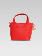 Load image into Gallery viewer, Back view of delphine bucket bag in red color
