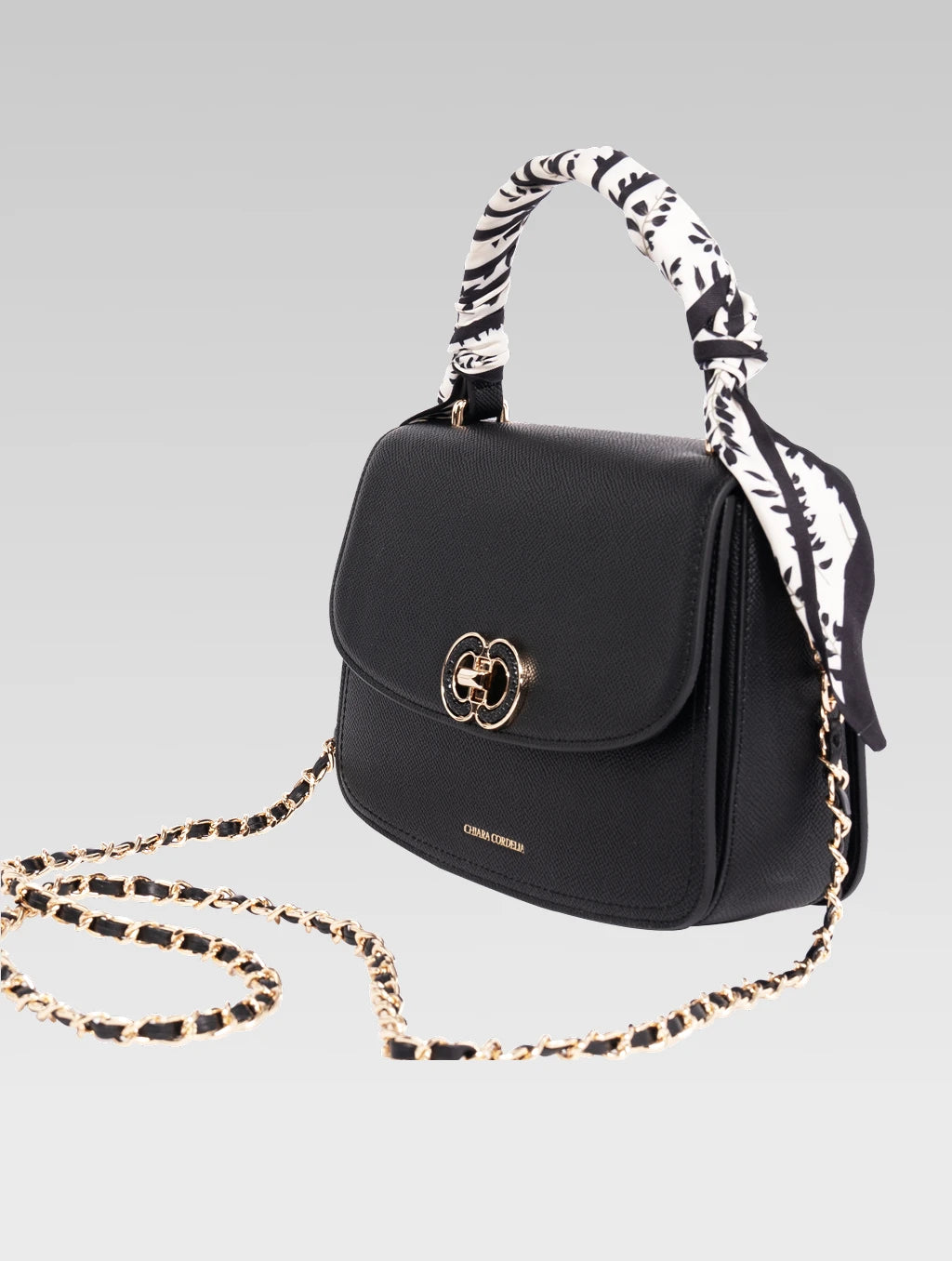 Side view of jane envelope bag with shoulder strap in black color