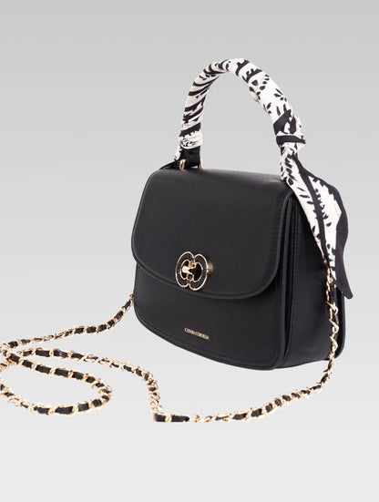 Side view of jane envelope bag with shoulder strap in black color