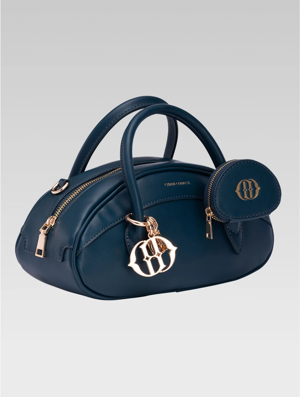 Side view of emberly envelope bag in royal teal color