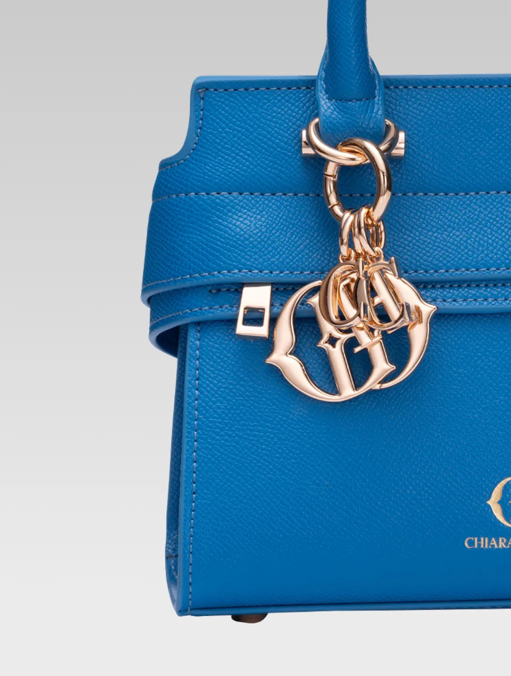 Front closeup view of ophelia envelope bag handle in baby pink color