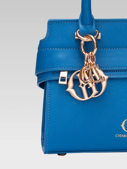 Front closeup view of ophelia envelope bag handle in baby pink color