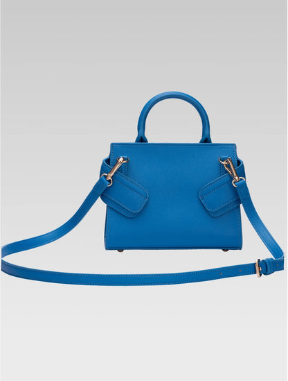 Back view of ophelia envelope bag with shoulder strap in blue color