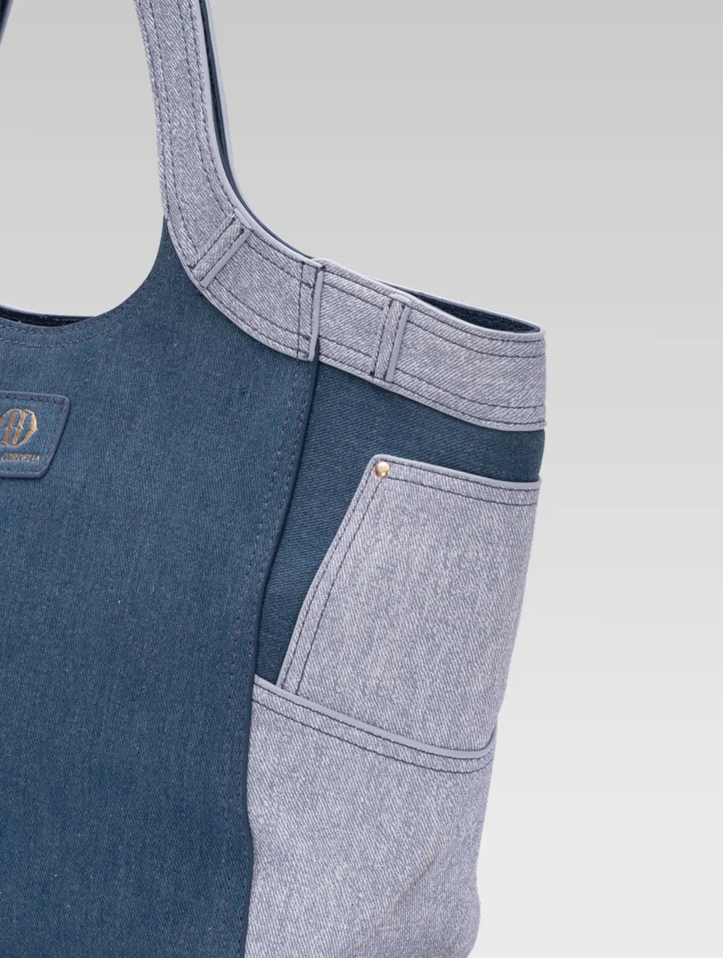 Cropped side view of Marlene dark blue demin tote bag