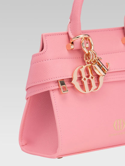 Side closeup view of ophelia envelope bag handle in baby pink color