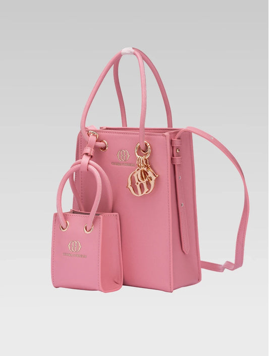 Side view of Genevieve Bucket bag in Baby pink color and a mini tote bag