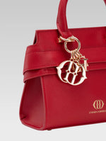 Load image into Gallery viewer, Side closeup view of ophelia envelope bag handle in red color
