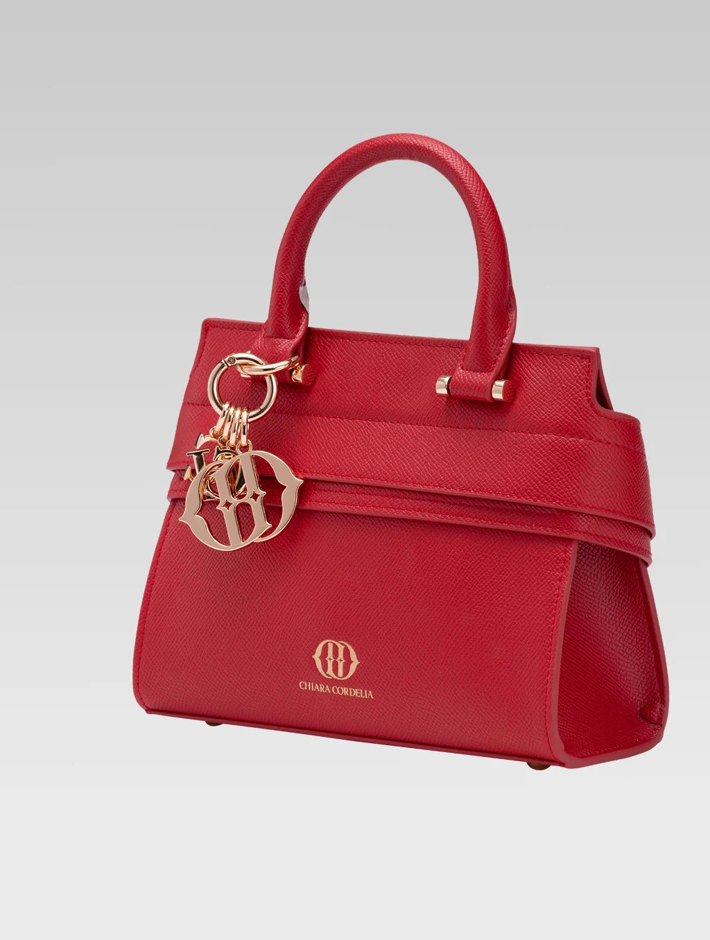 Side view of ophelia envelope bag handle in red color