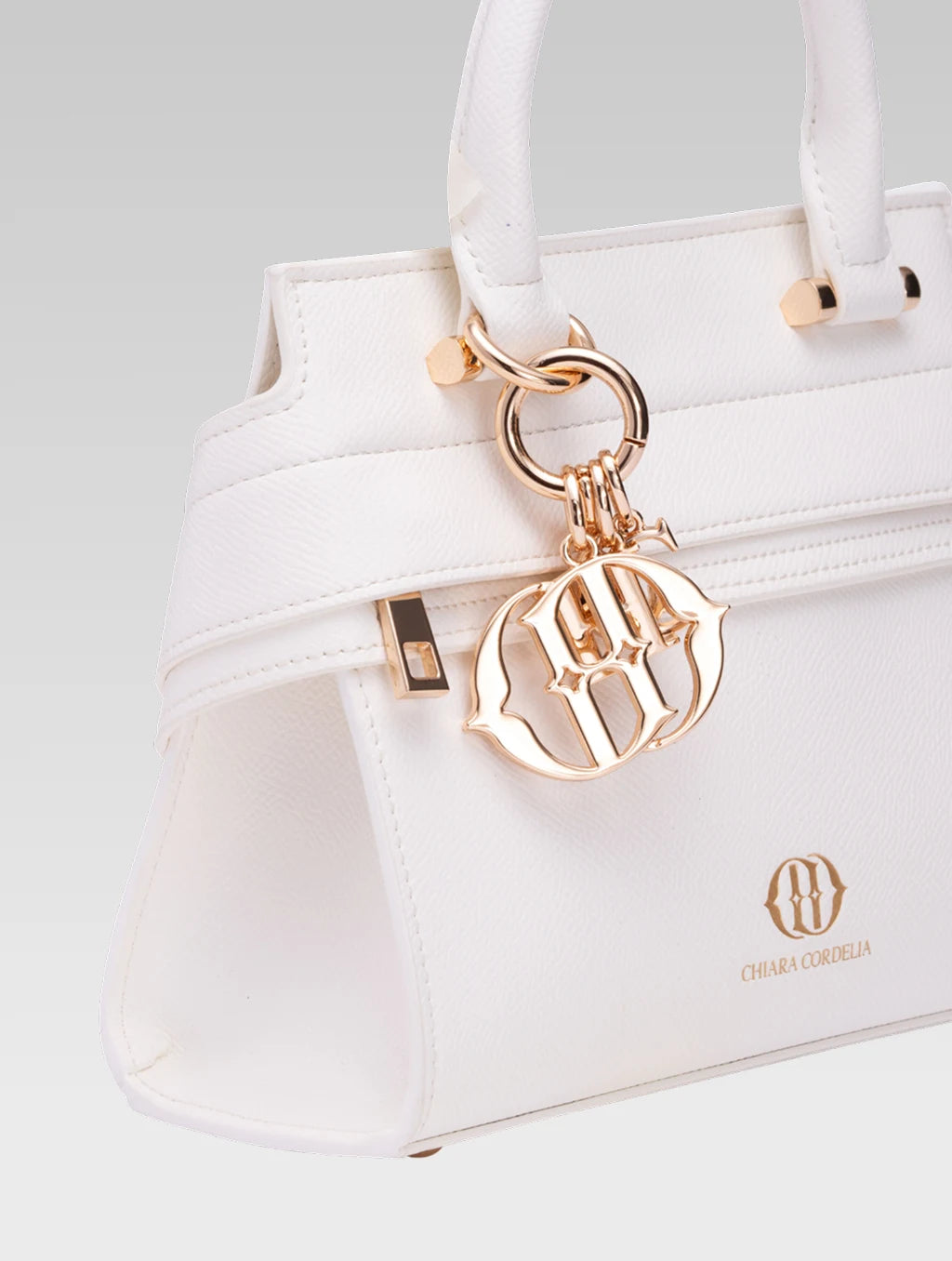 Side closeup view of ophelia envelope bag handle in white color